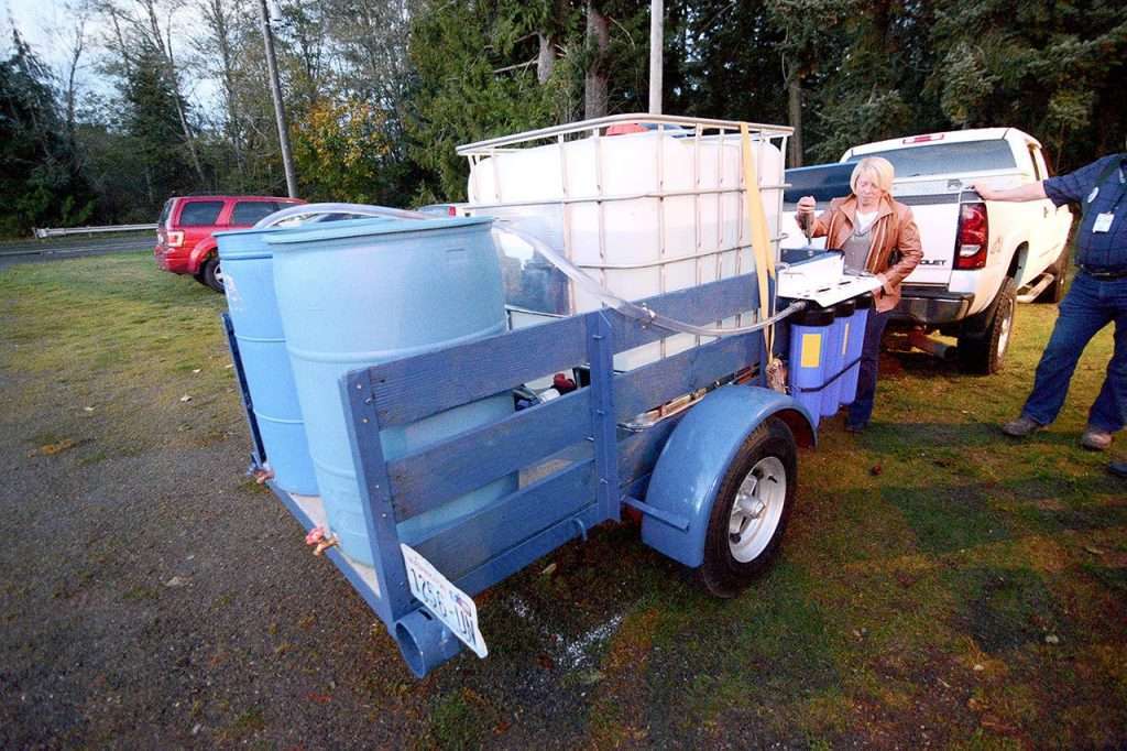 Portable hand-powered water purification system for emergency water supply.