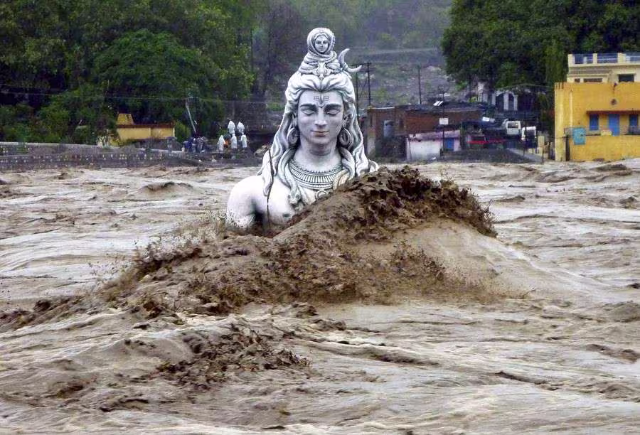Flood water reaching the head of a statue